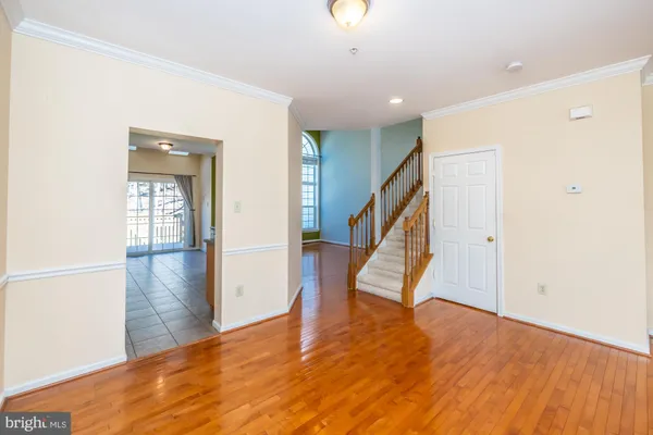a view of an entryway with wooden floor