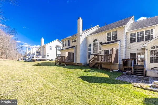 a view of a house with a yard and swimming pool