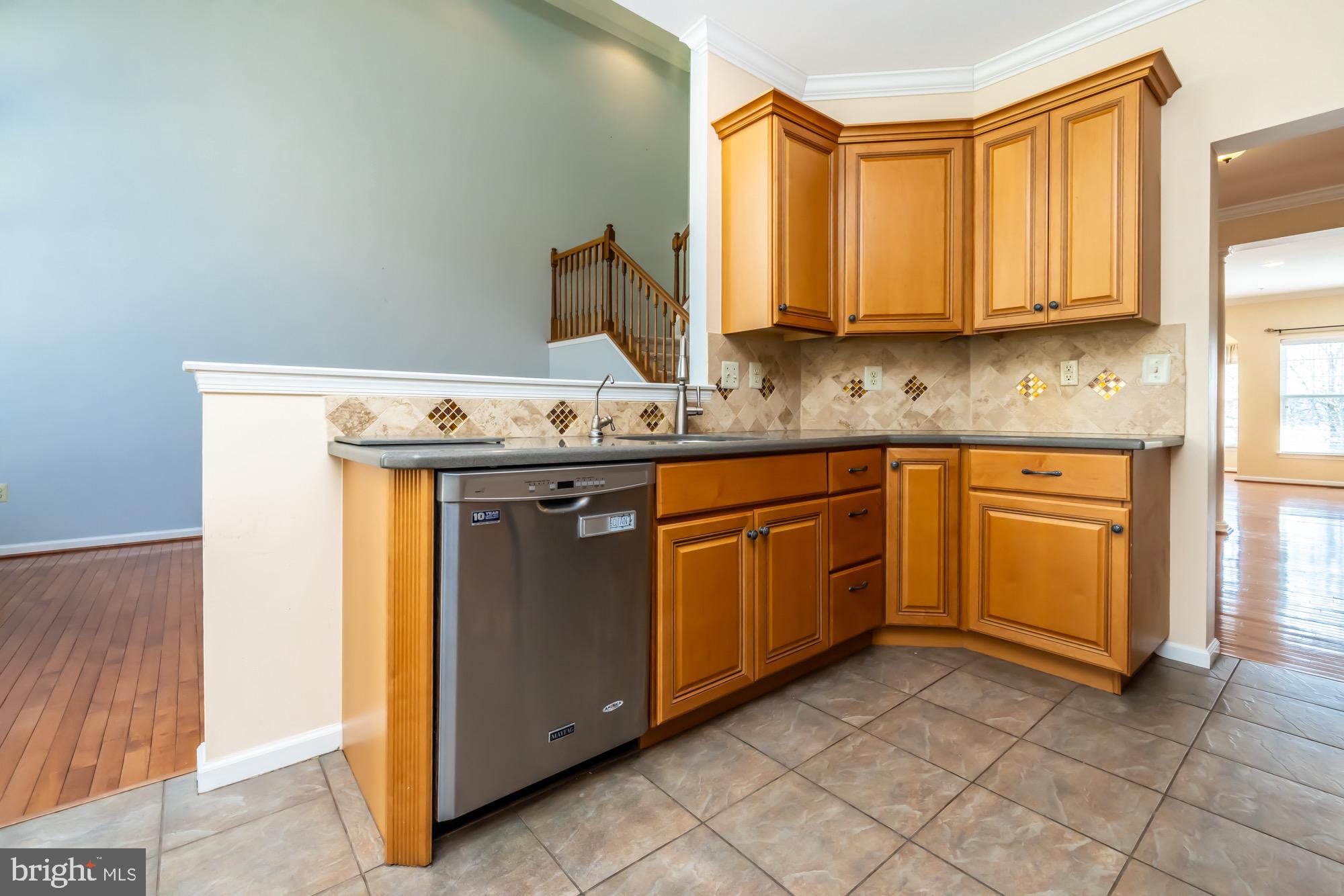 145 Madison Way Downingtown, PA 19335 - Photo 9 of 45 a kitchen with stainless steel appliances granite countertop a sink and a cabinets