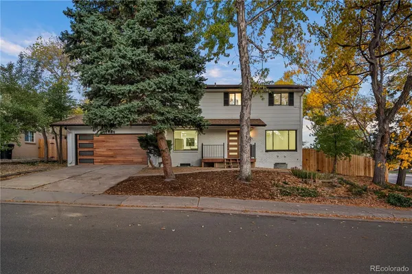 a front view of a house with a road