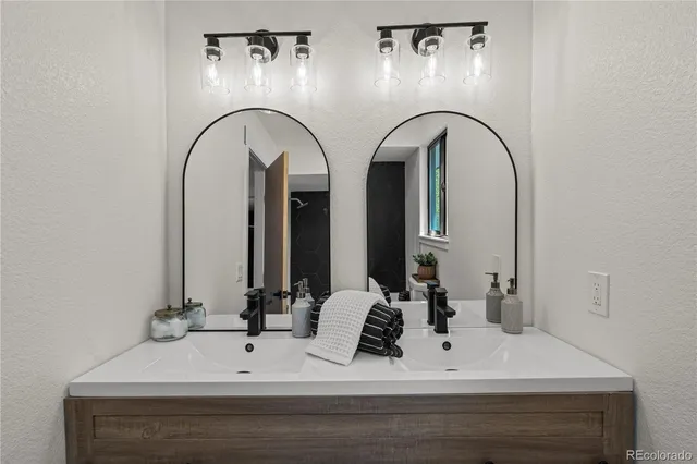 a bathroom with a double vanity sink