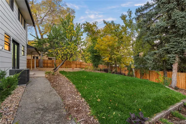 a backyard of a house with lots of green space