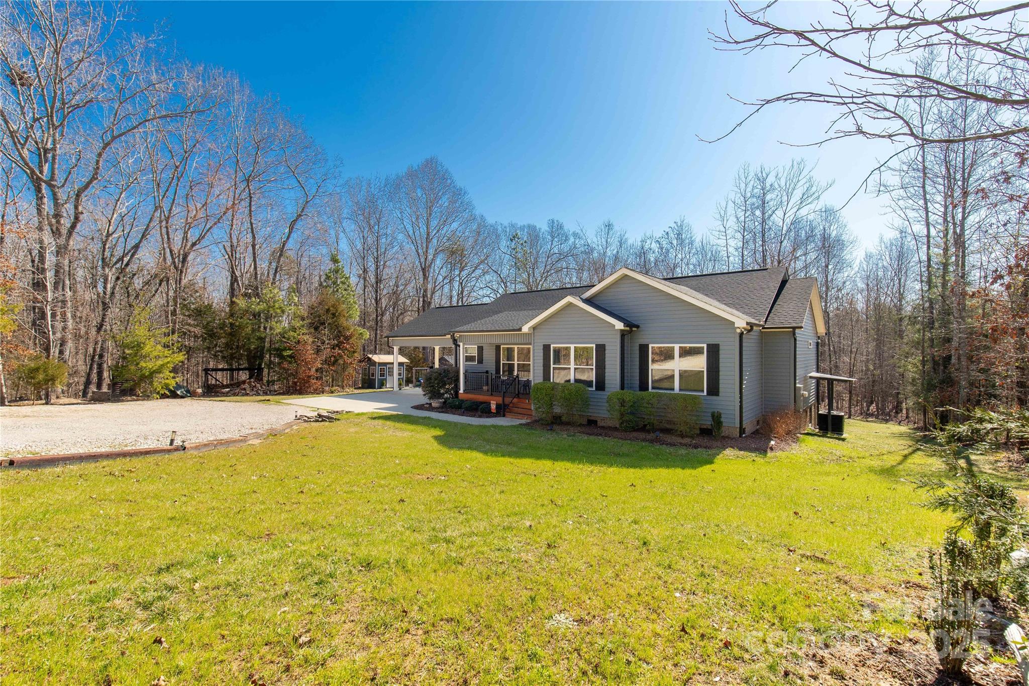 2925 Anderson Burgess Road Sharon, SC 29742 - Photo 23 of 45 a front view of house with yard and trees in the background