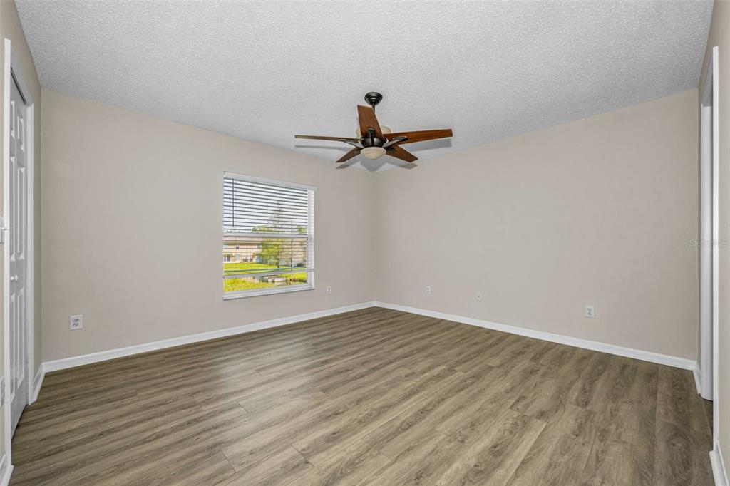8015 Savannah Sunset Lane Tampa, FL 33615 - Photo 17 of 35 a view of an empty room and window