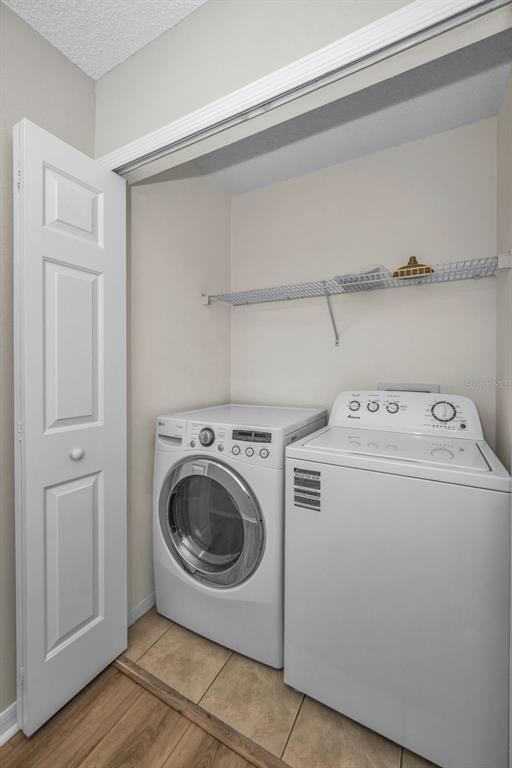 8015 Savannah Sunset Lane Tampa, FL 33615 - Photo 27 of 35 a utility room with dryer and washer