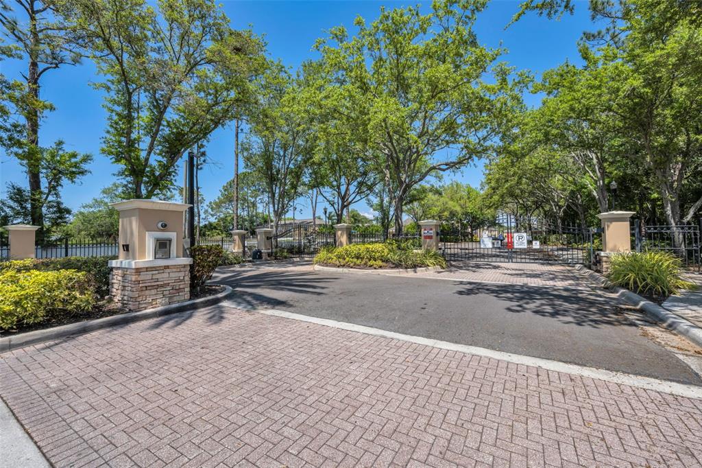 8015 Savannah Sunset Lane Tampa, FL 33615 - Photo 32 of 35 a view of street with a building and trees in the background