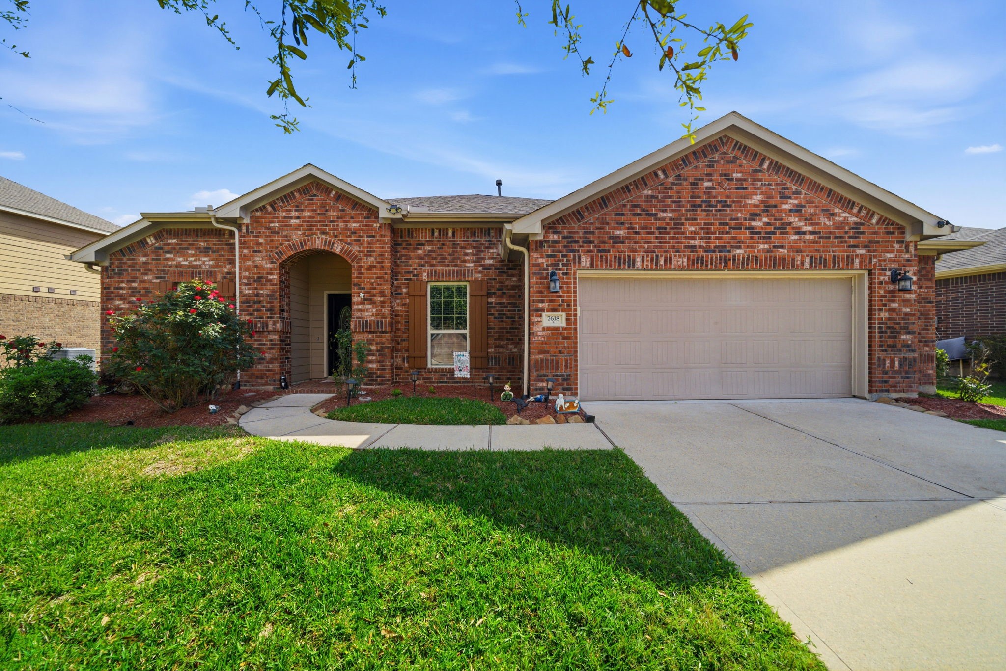 7618 Willow School Drive Spring, TX 77389 - Photo 1 of 19 a front view of a house with garden