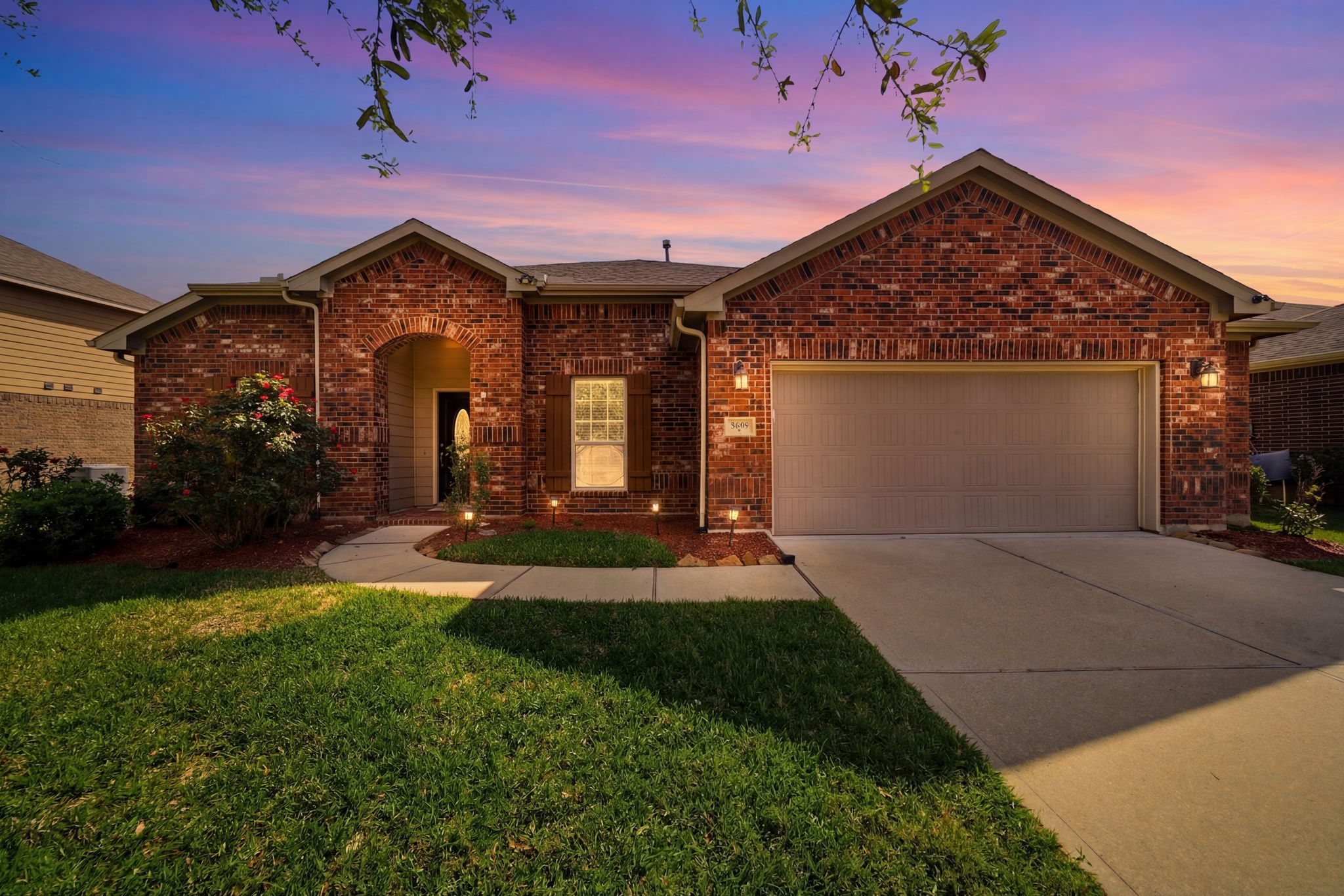 7618 Willow School Drive Spring, TX 77389 - Photo 2 of 19 a front view of a house with garden