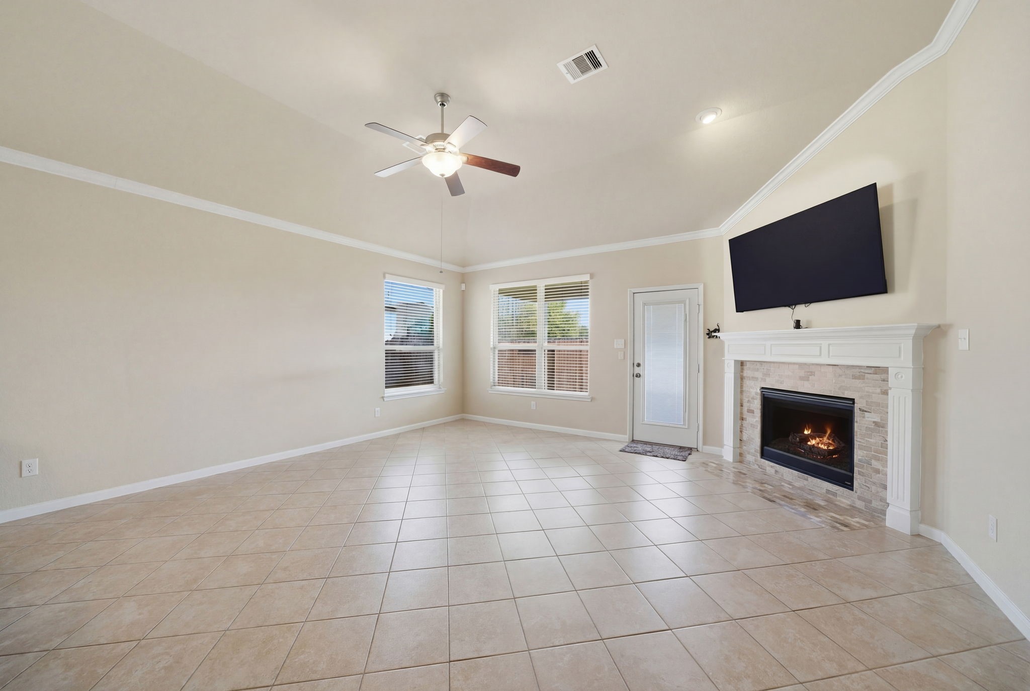 7618 Willow School Drive Spring, TX 77389 - Photo 10 of 19 a view of an empty room with fire place and a window