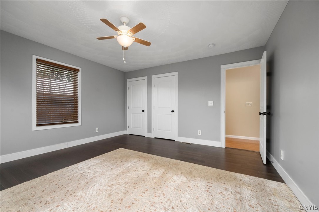 1322 Sawmill Road Sangerfield, NY 13480 - Photo 31 of 50 Rich dark wood floors ground this versatile bedroom featuring a wide window.
