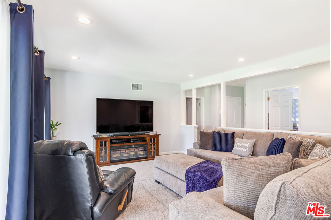 4253 Rudisill Street Montclair, CA 91763 - Photo 7 of 31 a living room with furniture and a flat screen tv