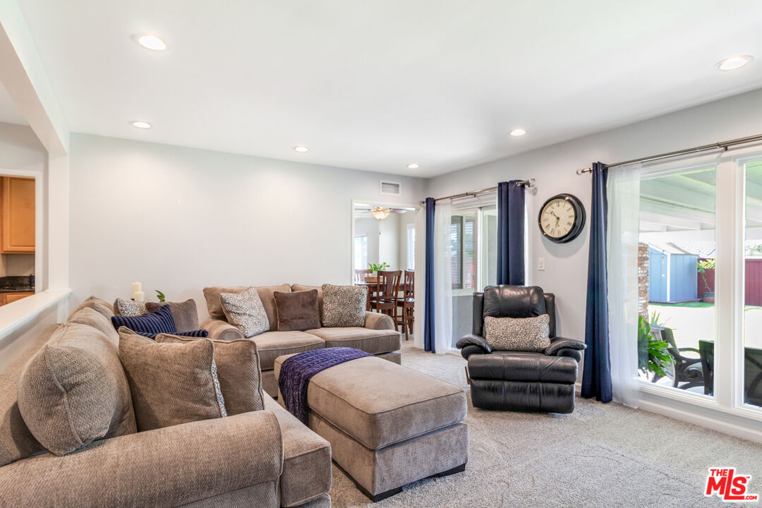 4253 Rudisill Street Montclair, CA 91763 - Photo 8 of 31 a living room with furniture and a large window
