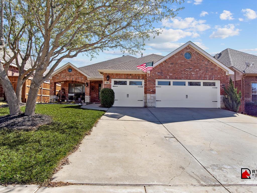 a view of a white house with a yard