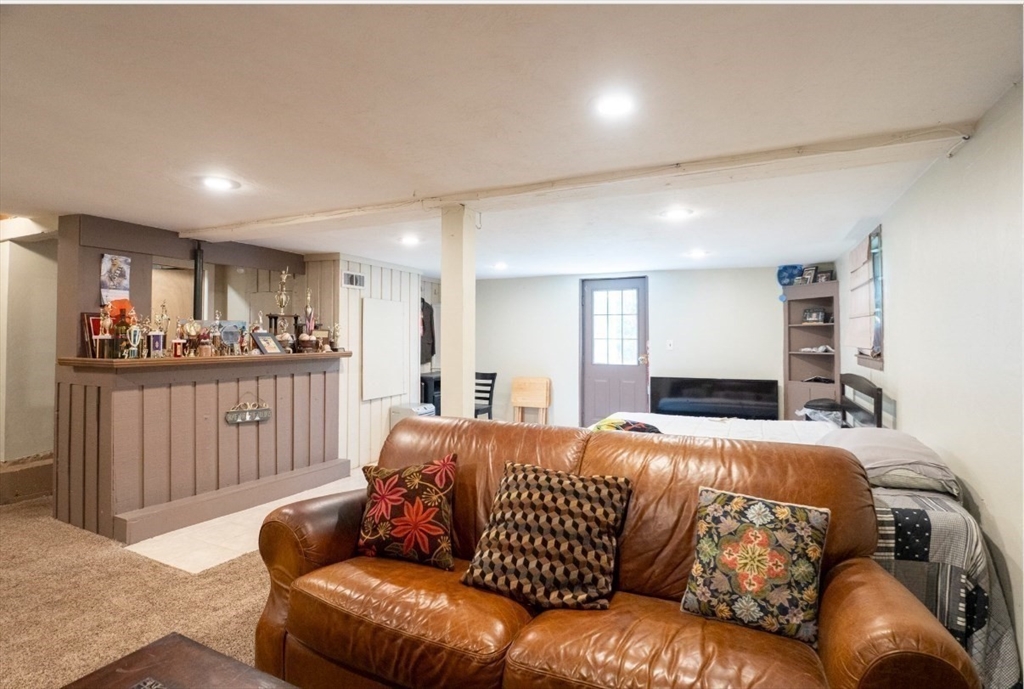 5 Amber Street Worcester, MA 01602 - Photo 9 of 13 a bedroom with a bed window and couch