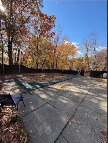 a view of a backyard of the house