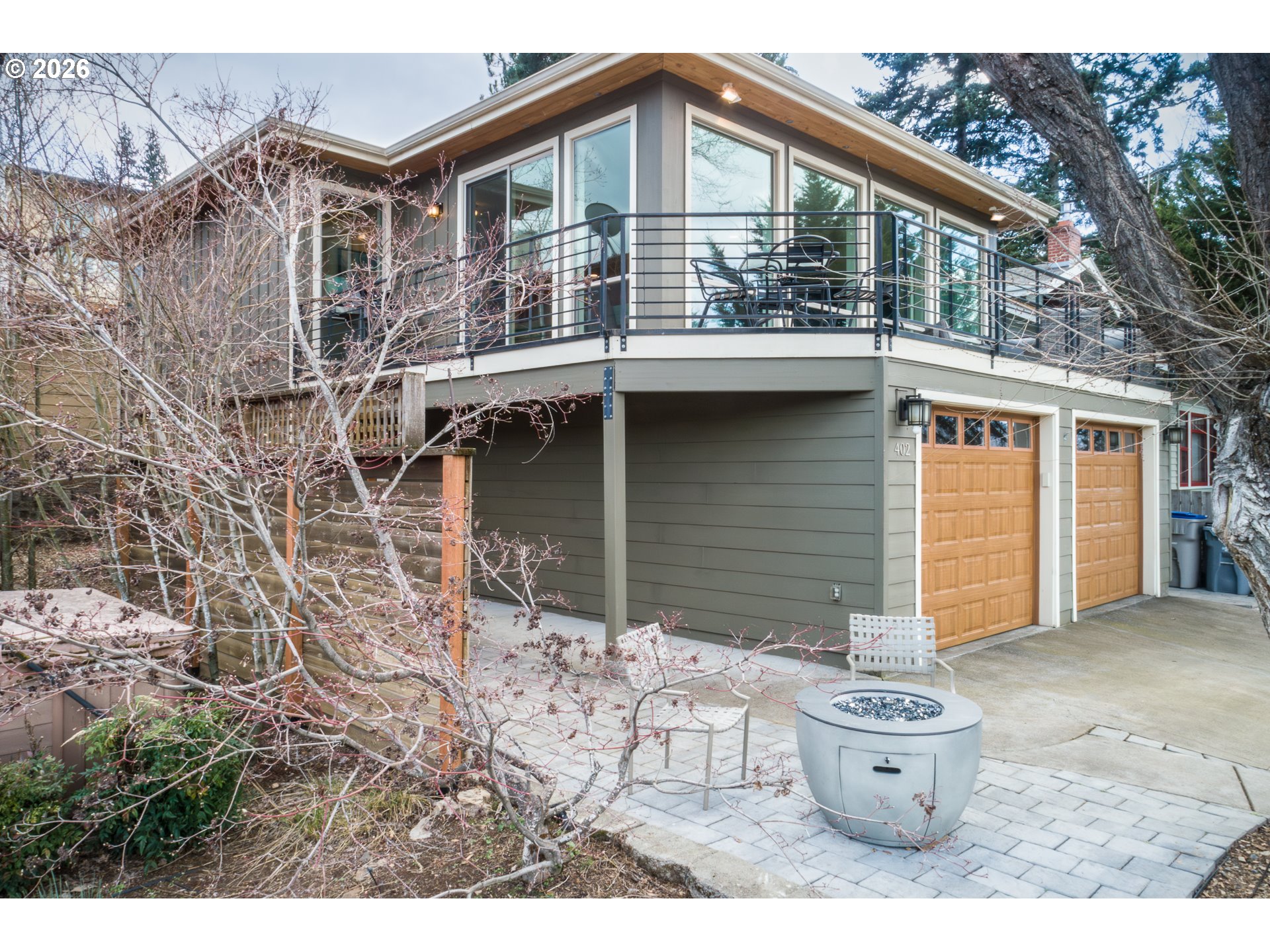 402 Bluff Road Hood River, OR 97031 - Photo 1 of 39 a backyard of a house with table and chairs