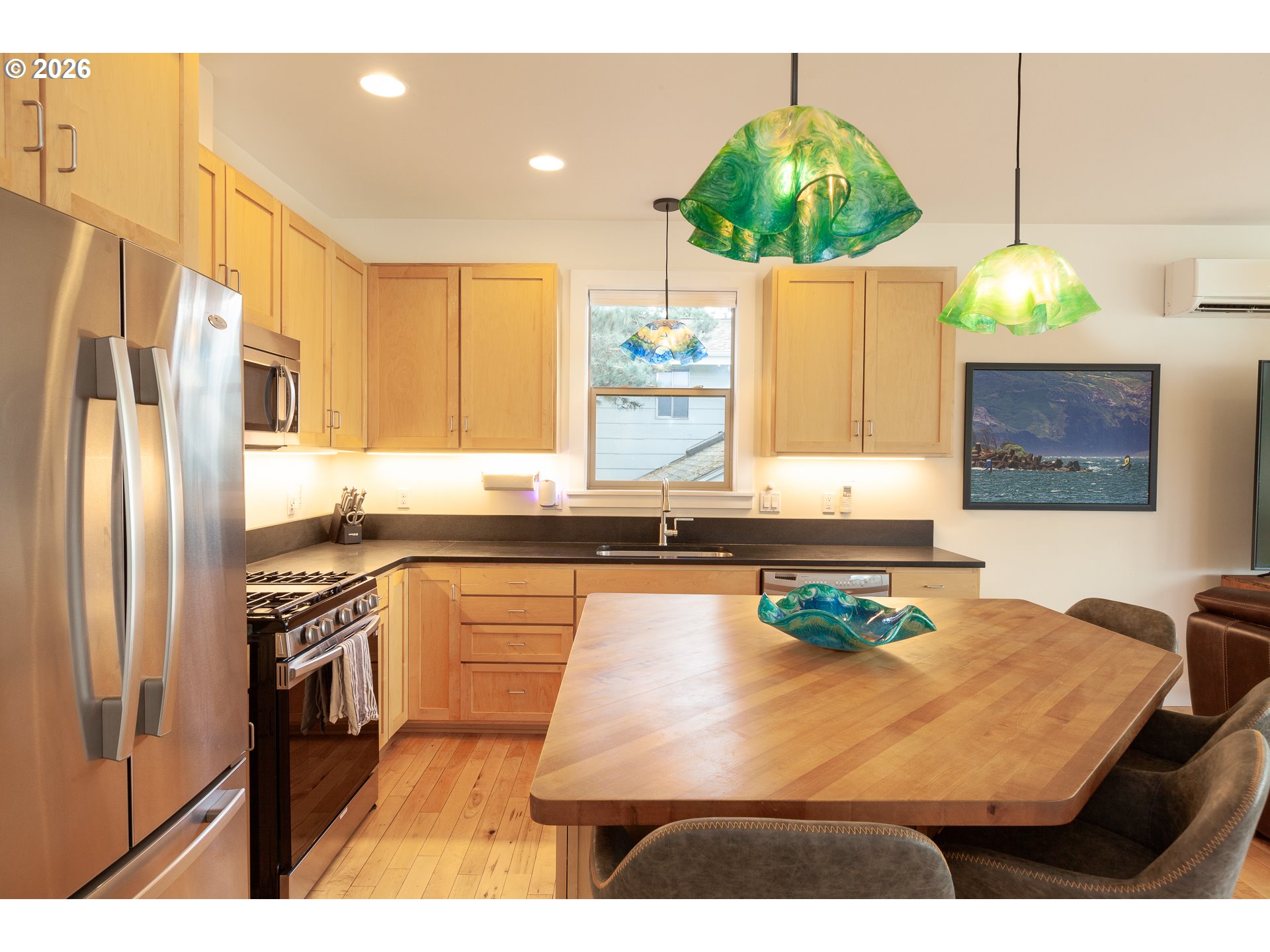 402 Bluff Road Hood River, OR 97031 - Photo 16 of 39 a kitchen with a sink a counter top space and stainless steel appliances