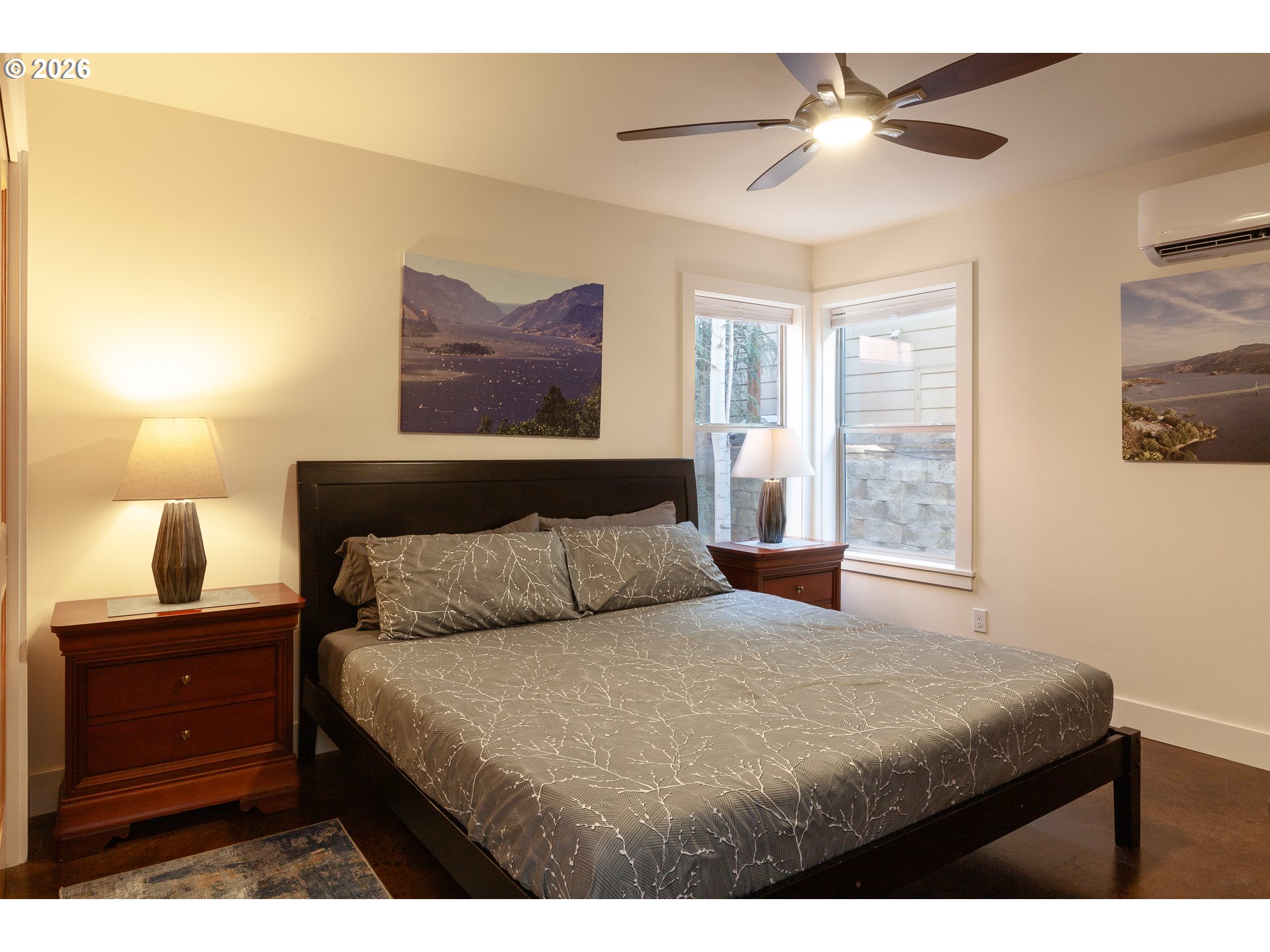 402 Bluff Road Hood River, OR 97031 - Photo 23 of 39 a bedroom with a bed and a lamp on dresser