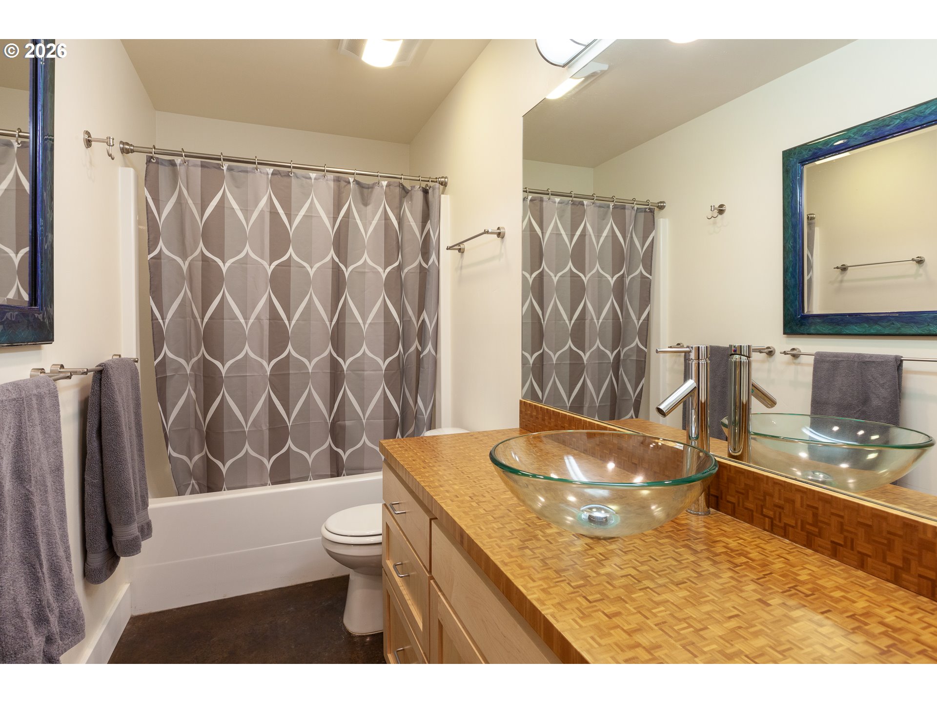 402 Bluff Road Hood River, OR 97031 - Photo 27 of 39 a bathroom with a granite countertop sink a toilet and a shower curtain