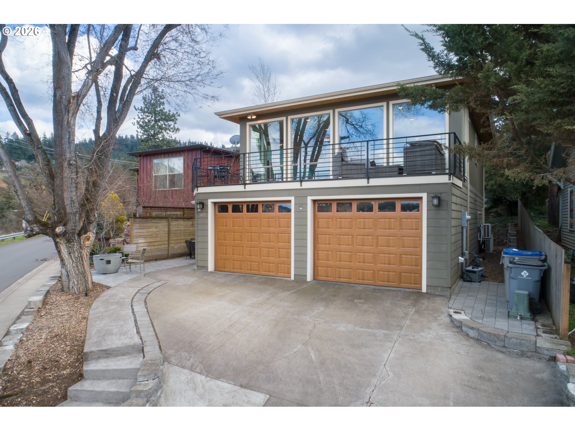 402 Bluff Road Hood River, OR 97031 - Photo 3 of 39 a view of a house with a yard and garage