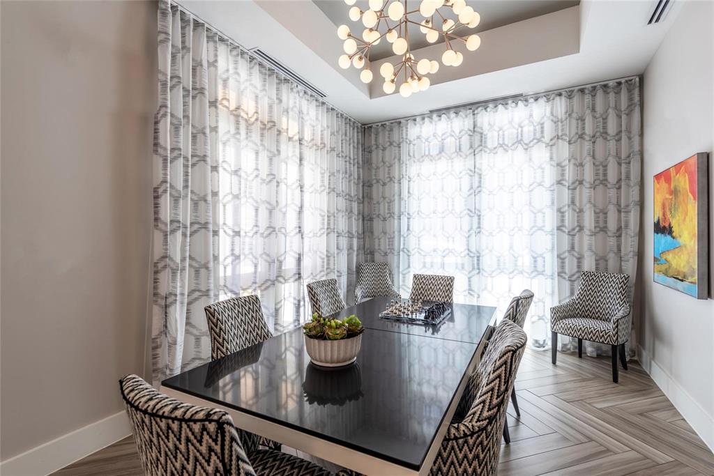 3100 Kramer Lane, Unit 309 Austin, TX 78758 - Photo 8 of 16 a view of a dining room with furniture a chandelier and wooden floor