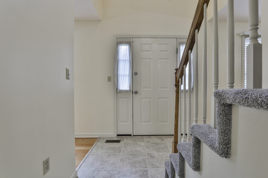 40 Mallard Point Road Merrimack, NH 03054 - Photo 20 of 40 a view of a livingroom with wooden floor and staircase
