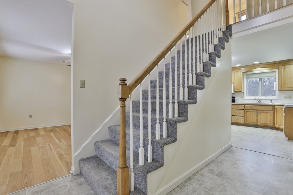 40 Mallard Point Road Merrimack, NH 03054 - Photo 2 of 40 a view of entryway and hall with wooden floor