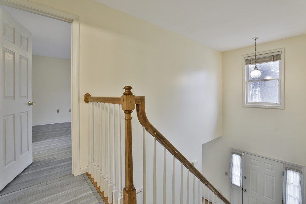 40 Mallard Point Road Merrimack, NH 03054 - Photo 21 of 40 a view of a hallway with wooden floor and staircase