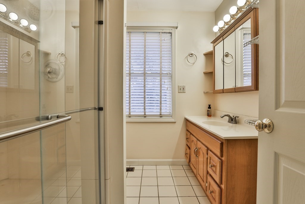 40 Mallard Point Road Merrimack, NH 03054 - Photo 25 of 40 a bathroom with a sink mirror and a shower
