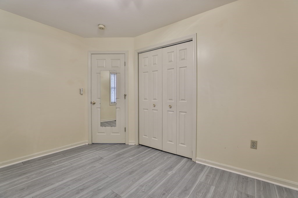 40 Mallard Point Road Merrimack, NH 03054 - Photo 29 of 40 a view of an empty room with wooden floor