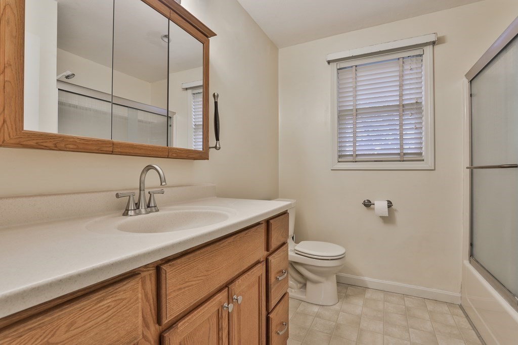 40 Mallard Point Road Merrimack, NH 03054 - Photo 31 of 40 a bathroom with a sink a toilet and a mirror