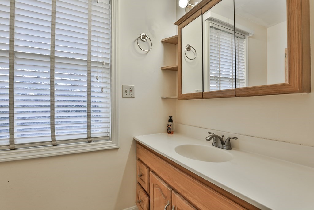 40 Mallard Point Road Merrimack, NH 03054 - Photo 32 of 40 a bathroom with a sink and a window