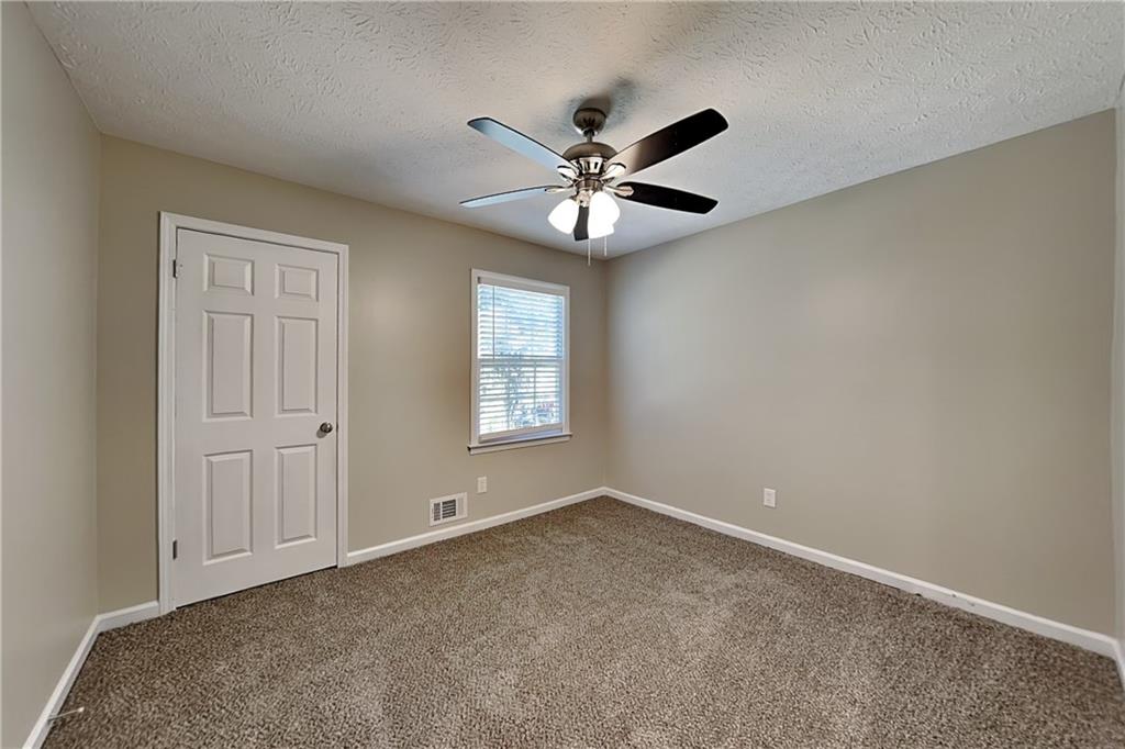 166 Kelly Court Dallas, GA 30157 - Photo 12 of 19 a view of an empty room with a window