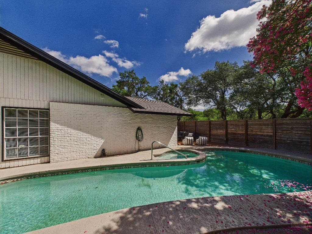 6108 Shadow Valley Drive, Unit A Austin, TX 78731 - Photo 11 of 31 a backyard of a house with table and chairs