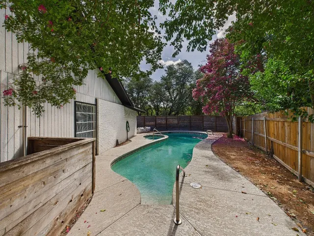 a view of a backyard with tree s