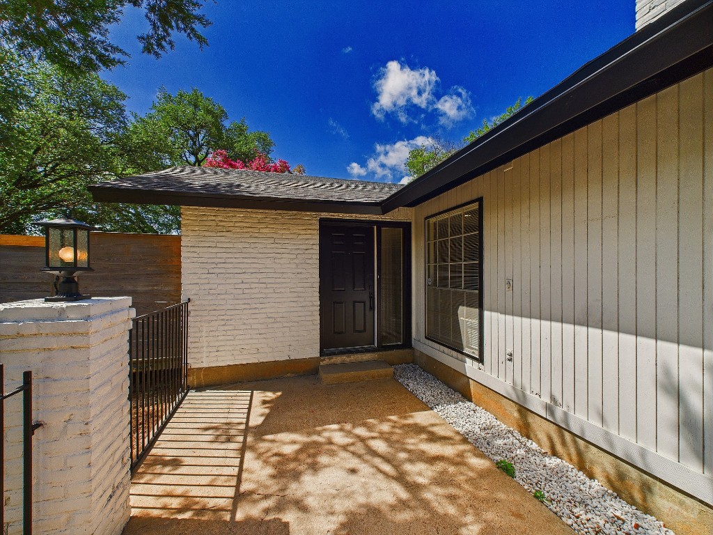 6108 Shadow Valley Drive, Unit A Austin, TX 78731 - Photo 16 of 31 a view of a porch with a table and chair