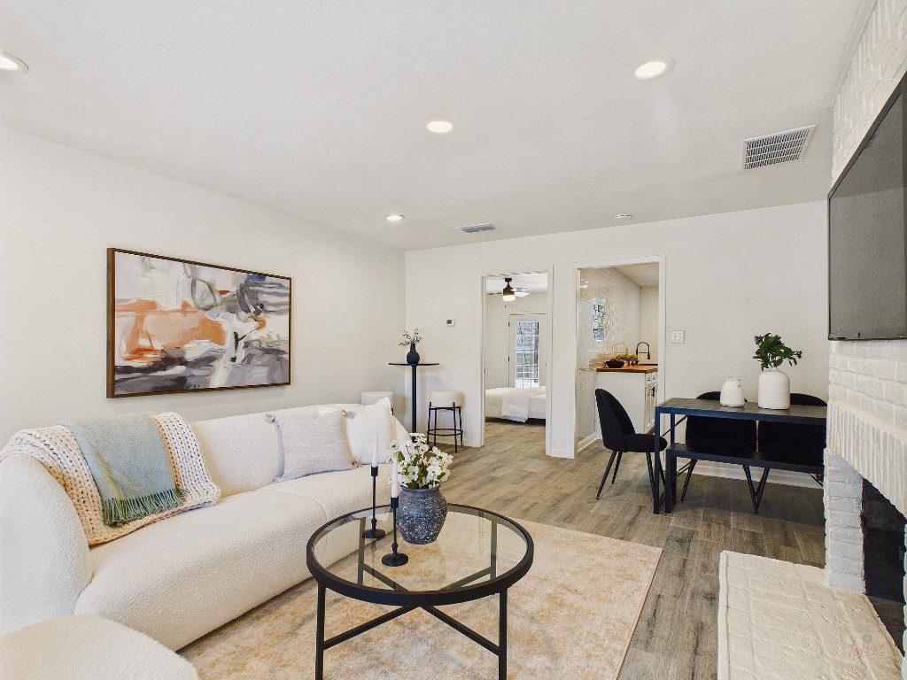 6108 Shadow Valley Drive, Unit A Austin, TX 78731 - Photo 22 of 31 a living room with furniture kitchen view and a table