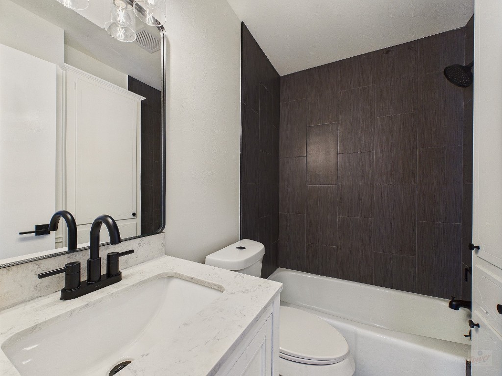 6108 Shadow Valley Drive, Unit A Austin, TX 78731 - Photo 25 of 31 a bathroom with a sink toilet and shower