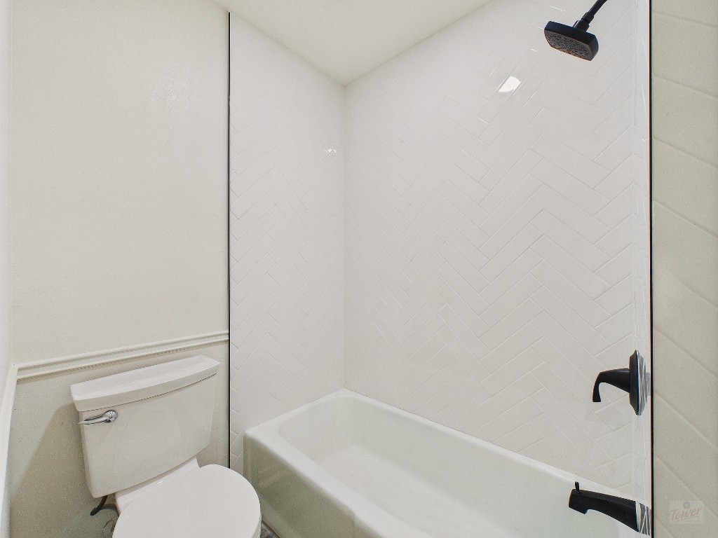 6108 Shadow Valley Drive, Unit A Austin, TX 78731 - Photo 28 of 31 a white toilet sitting next to a bath tub