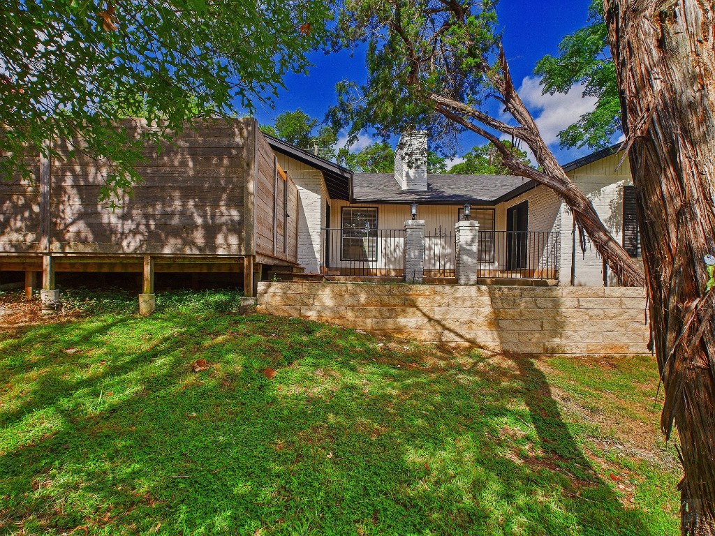 6108 Shadow Valley Drive, Unit A Austin, TX 78731 - Photo 5 of 31 a house view with a garden space