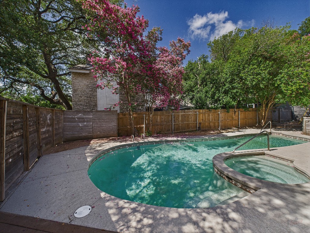 6108 Shadow Valley Drive, Unit A Austin, TX 78731 - Photo 9 of 31 a view of a backyard with wooden fence