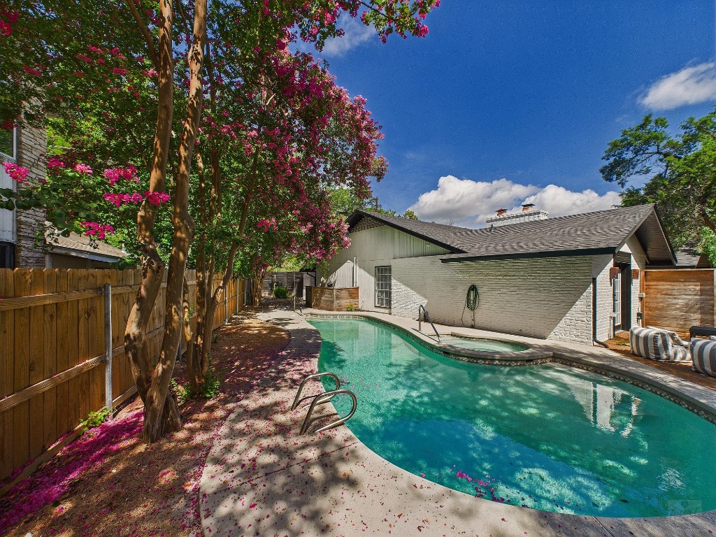 6108 Shadow Valley Drive, Unit A Austin, TX 78731 - Photo 10 of 31 a front view of a house with garden