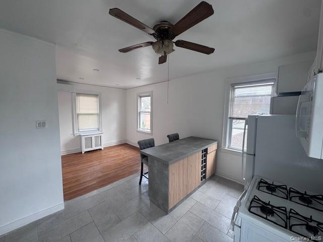 530 Fourth Avenue, Unit 2 Pelham, NY 10803 - Photo 1 of 8 a kitchen with stainless steel appliances granite countertop a sink stove and refrigerator