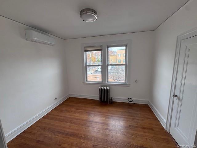 530 Fourth Avenue, Unit 2 Pelham, NY 10803 - Photo 6 of 8 an empty room with wooden floor and windows