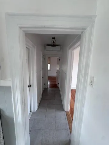 a view of a hallway view with staircase