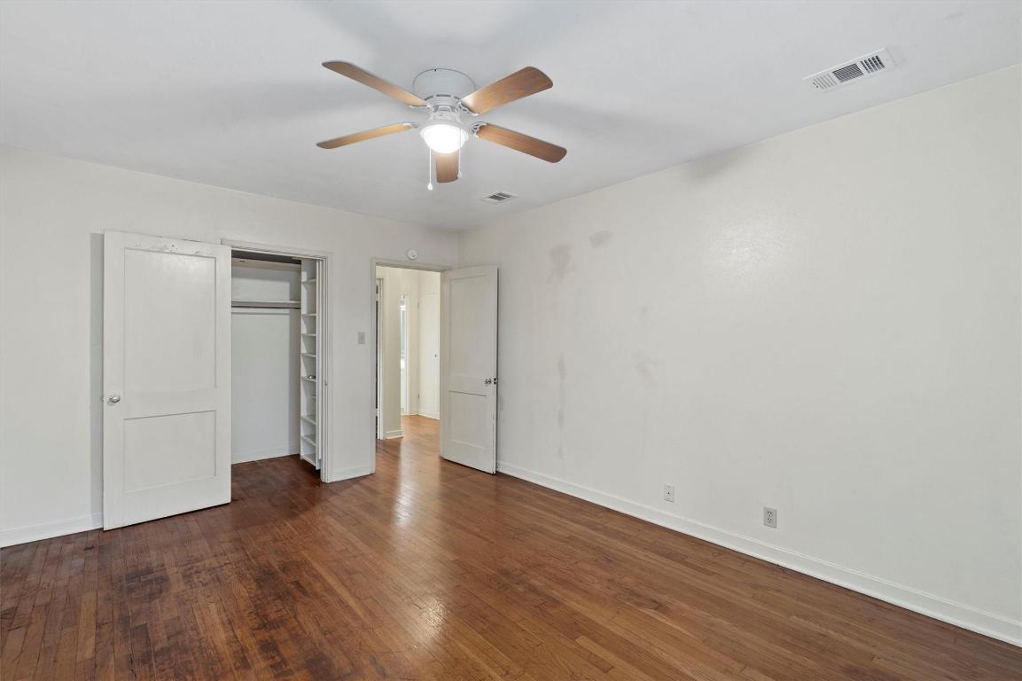 1511 Alguno Road Austin, TX 78757 - Photo 12 of 25 a view of an empty room with wooden floor