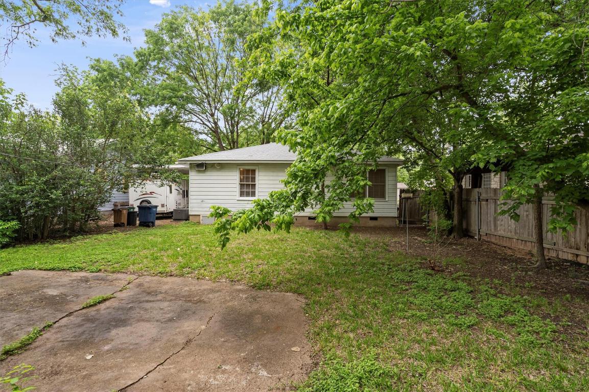 1511 Alguno Road Austin, TX 78757 - Photo 18 of 25 a front view of a house with a yard and trees