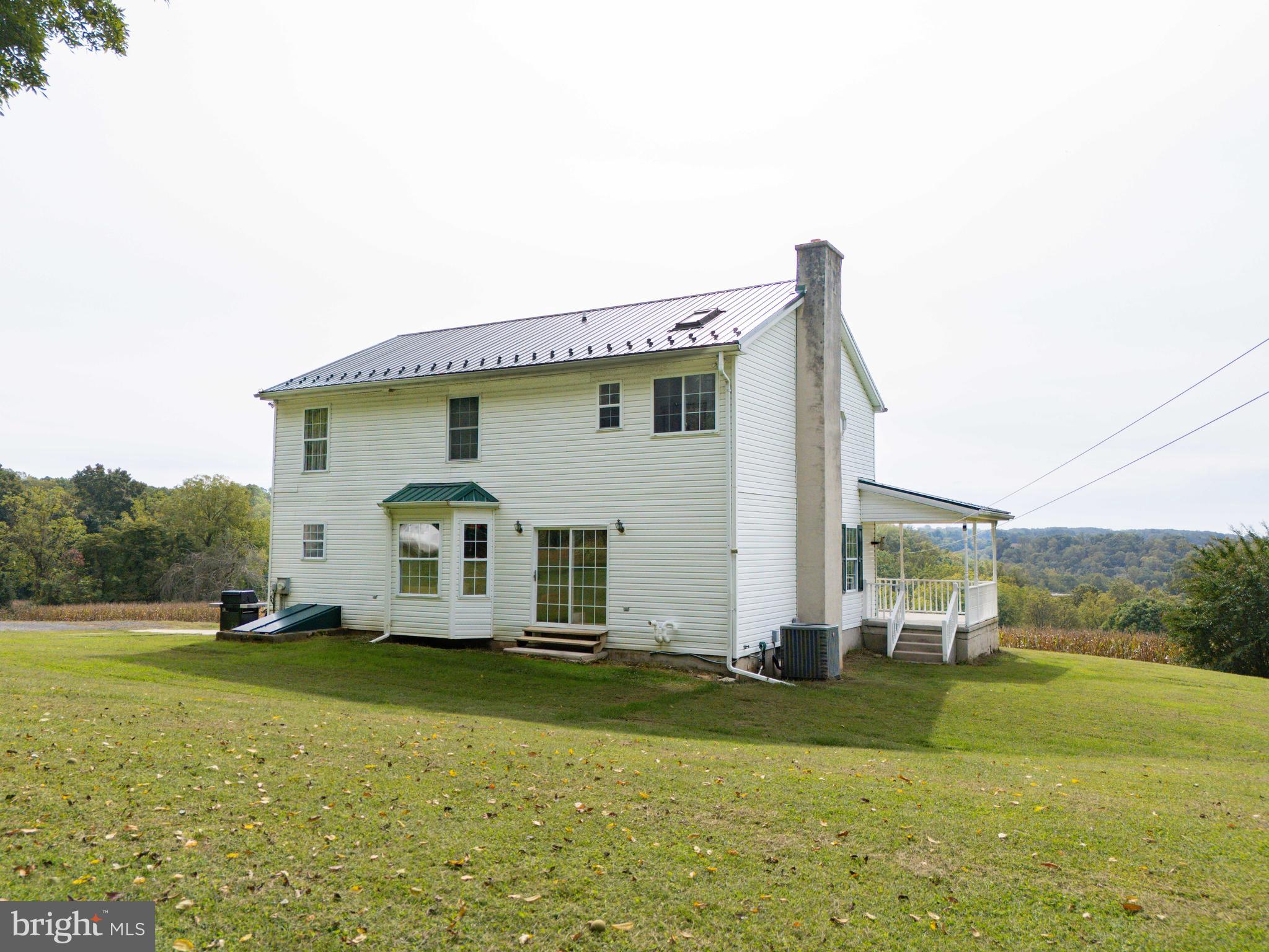 424 Springhill Road Rising Sun, MD 21911 - Photo 11 of 42 a front view of a house with garden