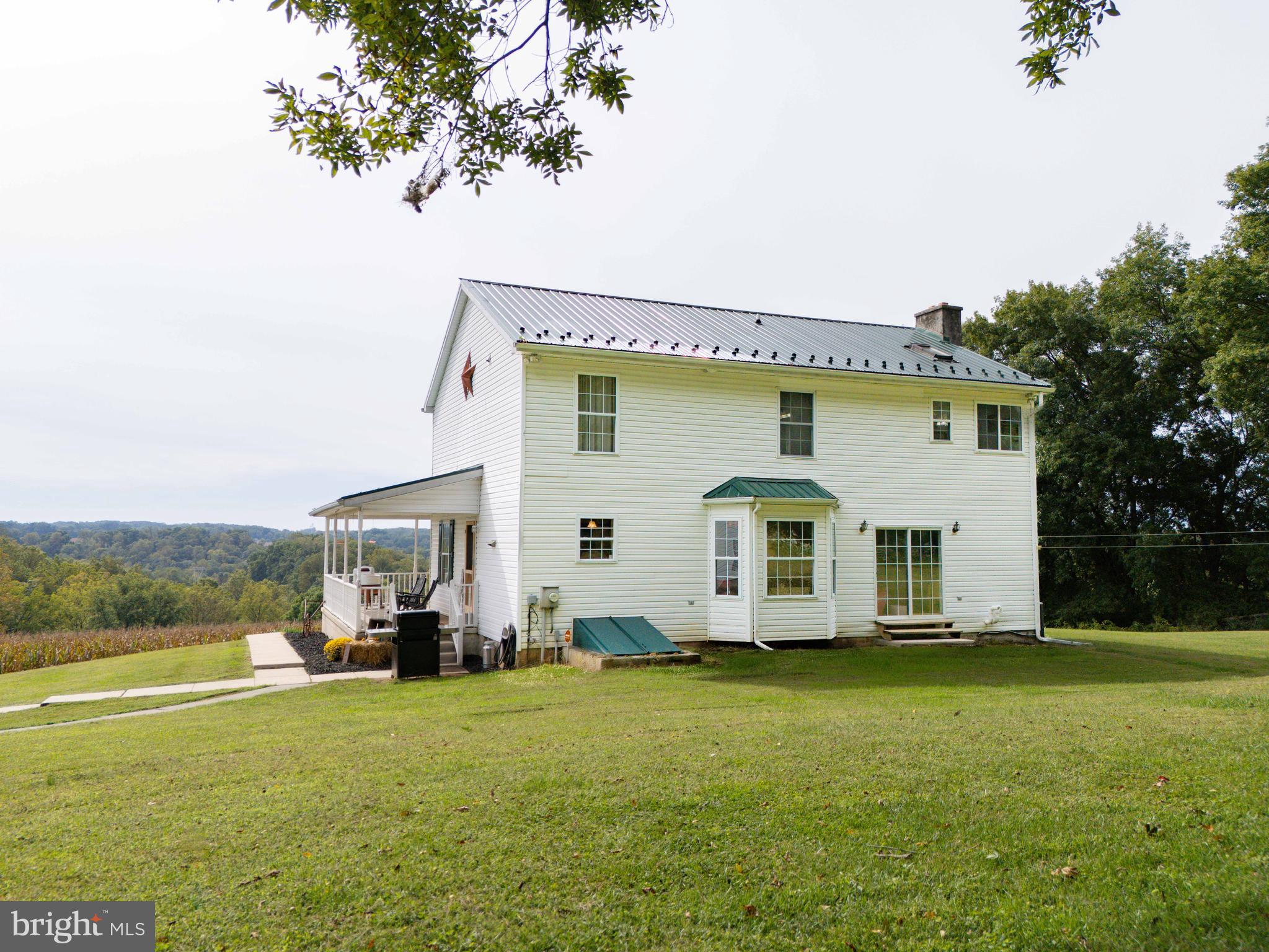 424 Springhill Road Rising Sun, MD 21911 - Photo 12 of 42 a front view of a house with garden