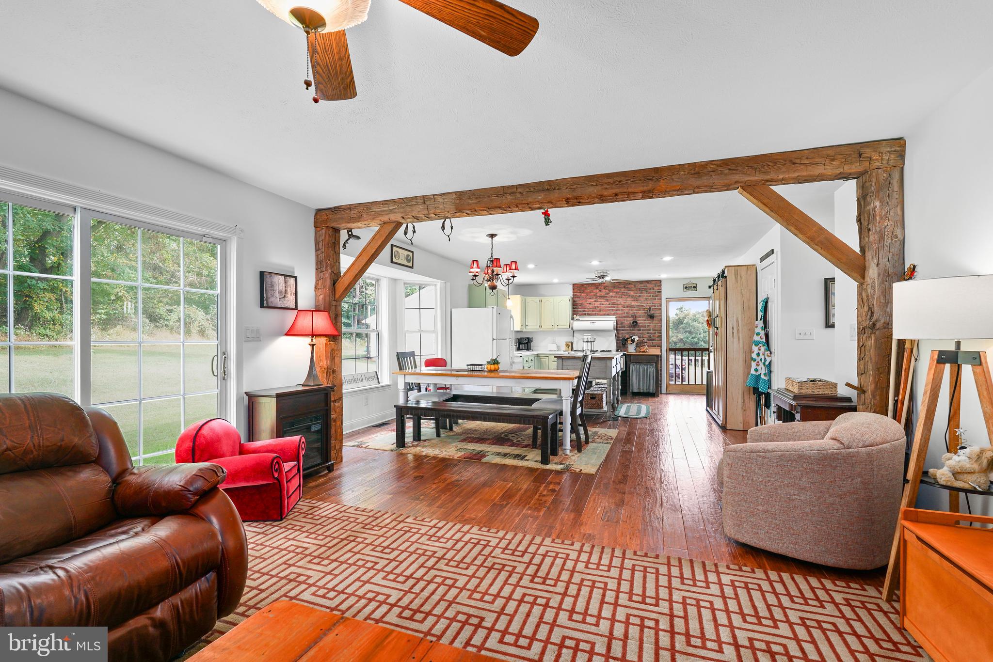 424 Springhill Road Rising Sun, MD 21911 - Photo 25 of 42 a living room with furniture a rug and a floor to ceiling window